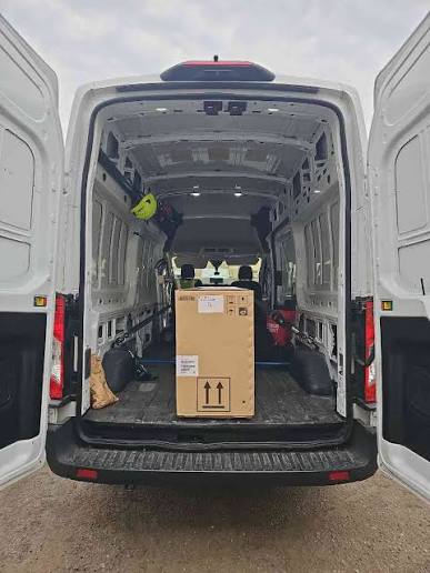 Cargo van loaded with a boxed shipment for direct freight delivery