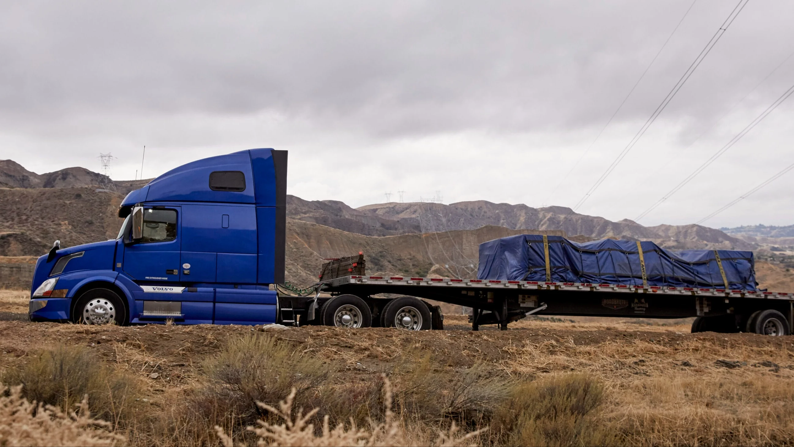 Flatbed truck freight on an over-the-road route